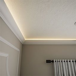 Ekena Millwork - MLD03X03X04RK - EnduraGlow Rockwall Crown Moulding, Backlit LED Compatible, 3 1/4"H x 2 3/4"P x 4 1/4"F x 94 1/2"L, Primed Urethane